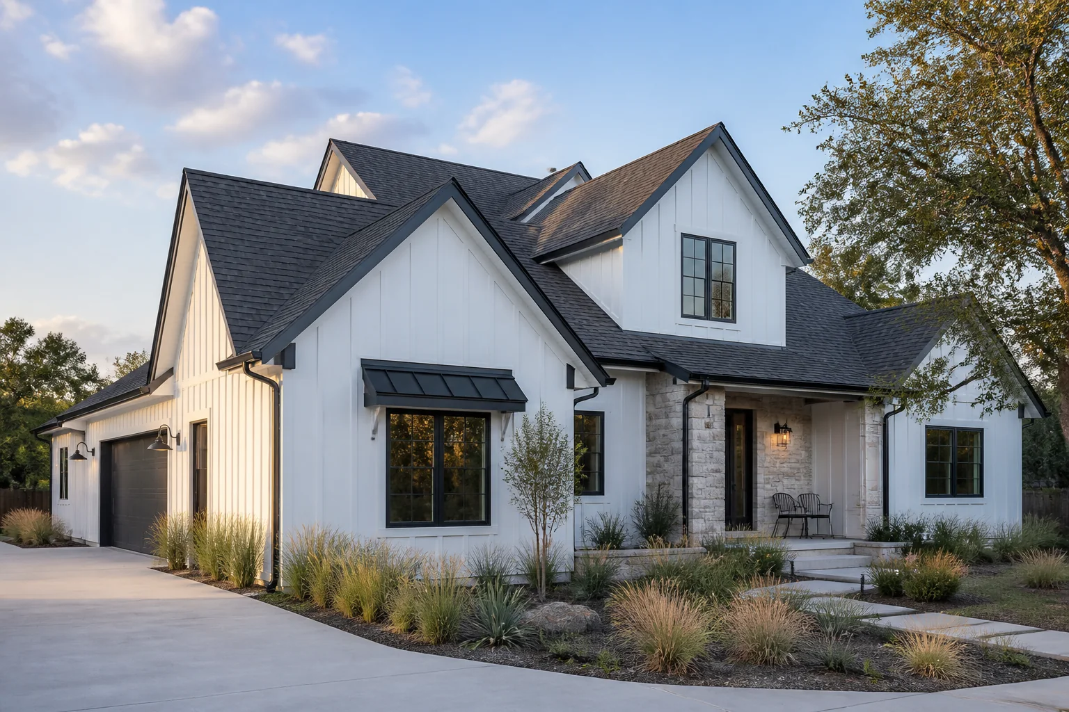 Completed charcoal shingle roof on a white modern farmhouse