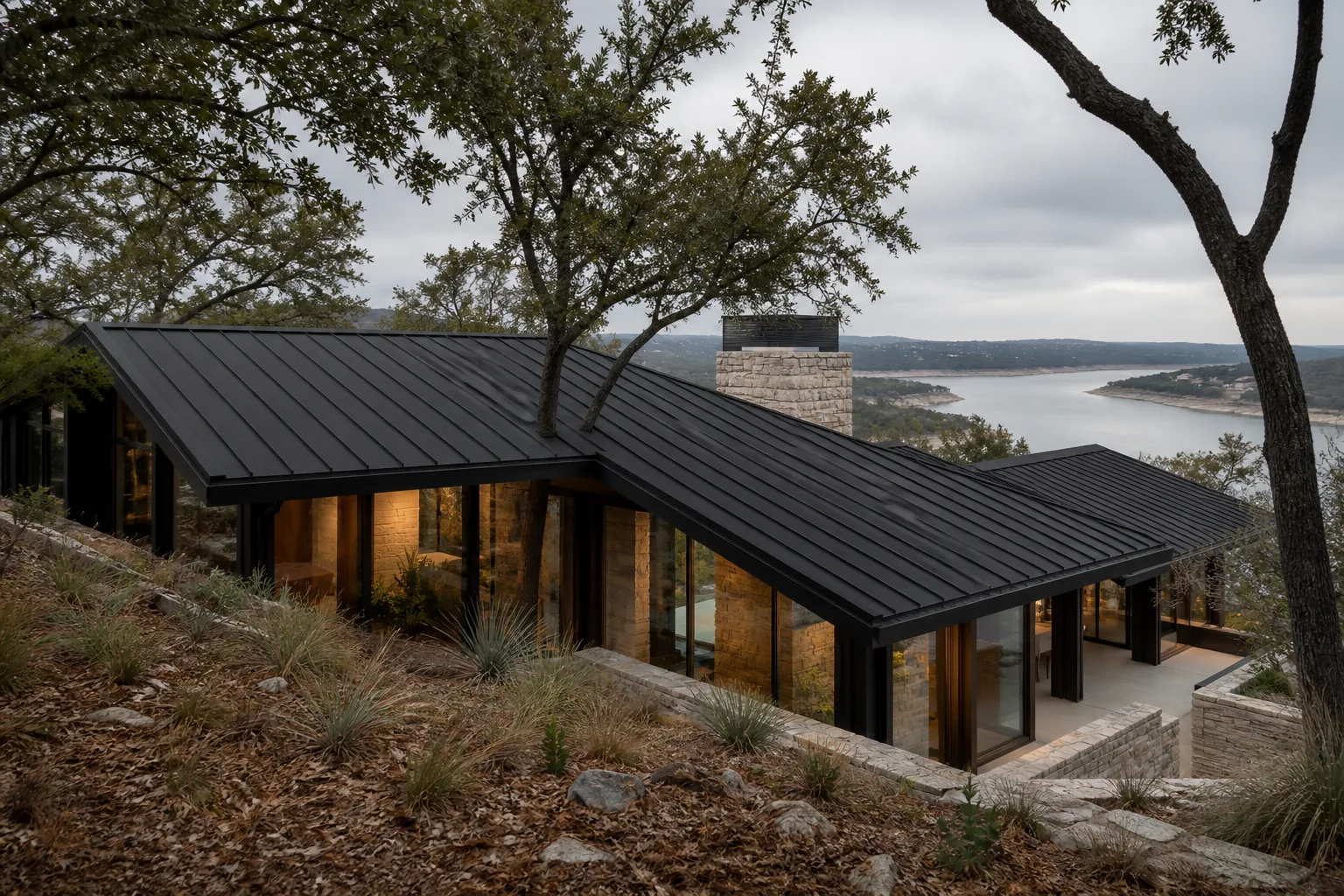 Completed standing-seam roof on a limestone home near Dripping Springs