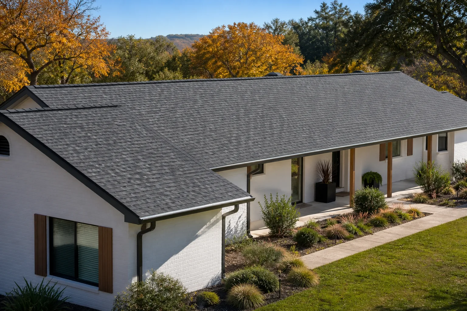 Completed charcoal architectural shingle roof on a Barton Creek farmhouse
